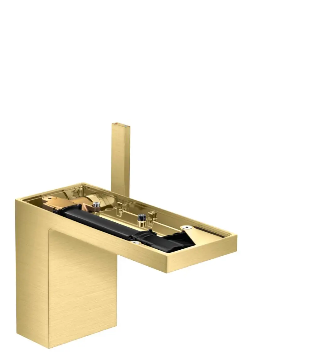 Ein AXOR-Waschtischmischer in gebürstetem Messing, mit einem kompakten Design und einem sichtbaren Inneren, das die technischen Komponenten zeigt.
